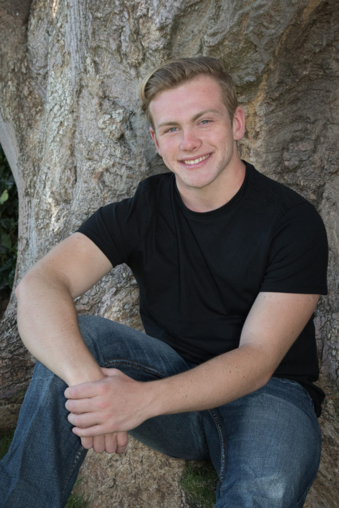photography - Business portrait casual Caucasian young man in front of tree