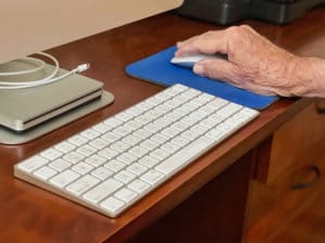 Use of technology keyboard, computer, mouse, mouse pad, man's hand