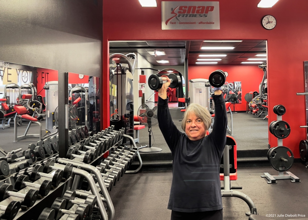 julie demonstrates free weights snap fitness