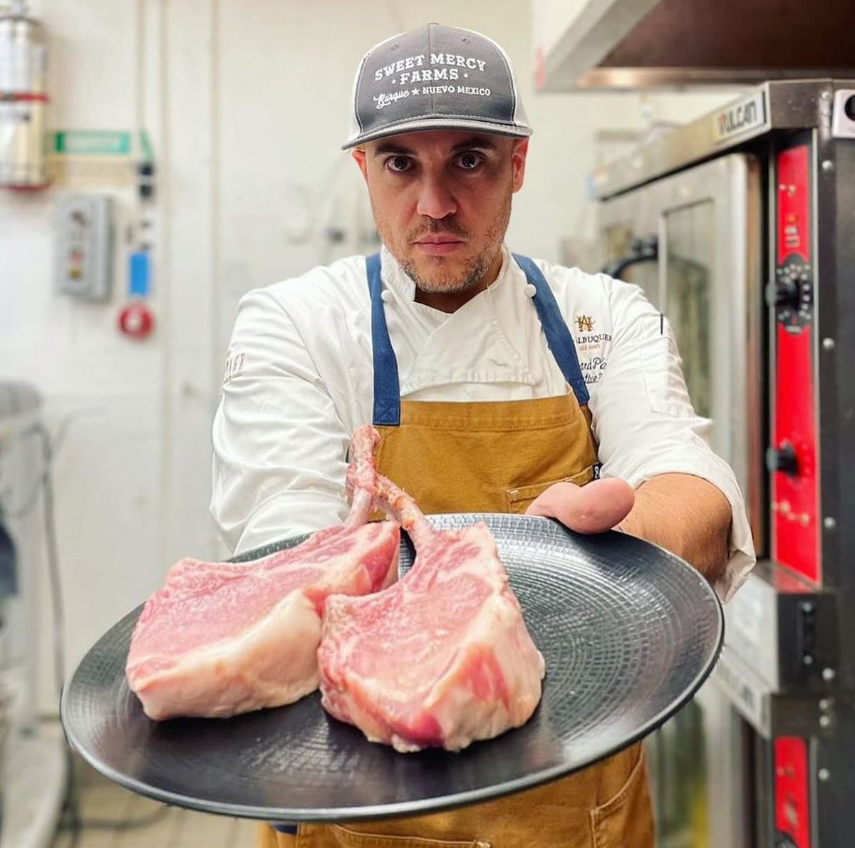 Executive Chef Richard Padilla presents pork chops