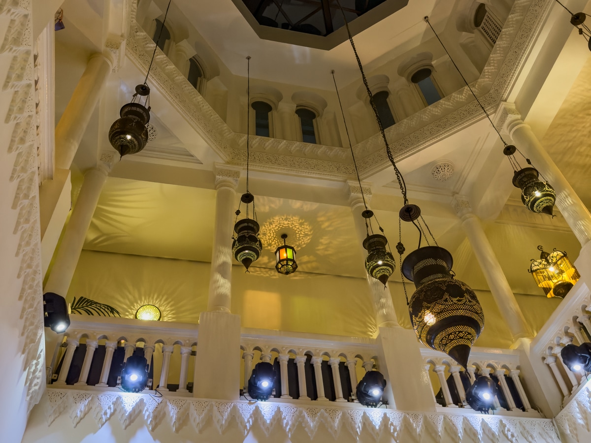 The ceiling dome at Rick's Café with light fixtures made from brass and glass.